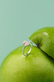 Luna Owl Ring on a green apple